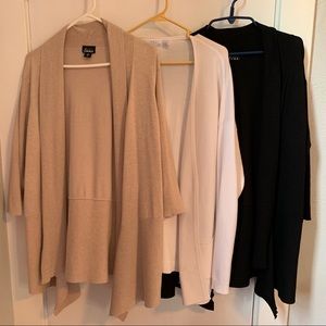 3 cardigan sweaters together.